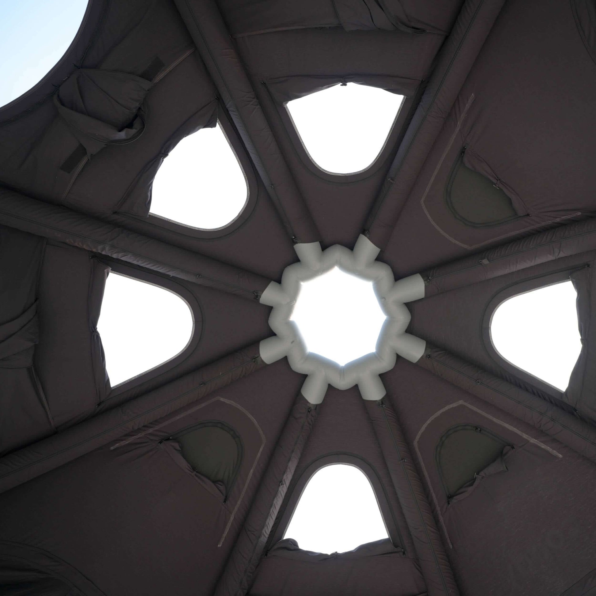 tent Ceiling with a central circular design and arches