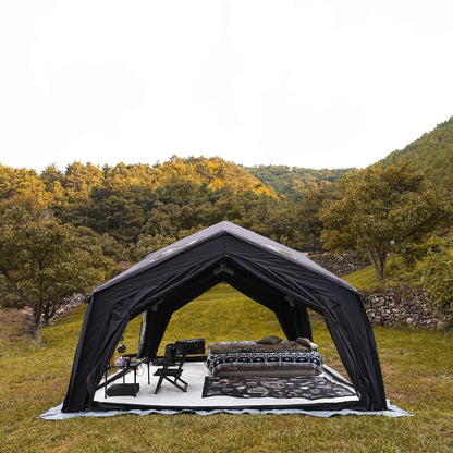 Black tent with outdoor furniture