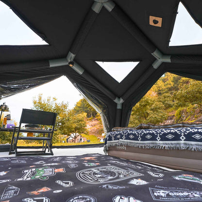 Campsite with a tent, chair, and outdoor furniture set 